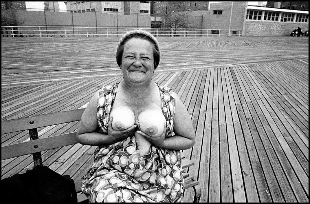 USA. NYC. Coney Island. 1977. Woman exposing her breats on the boardwalk.