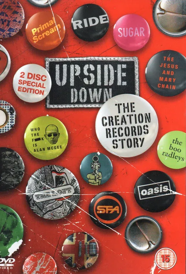Portada del DVD “Upside Down: The Creation Records Story” con botones de bandas icónicas del sello.