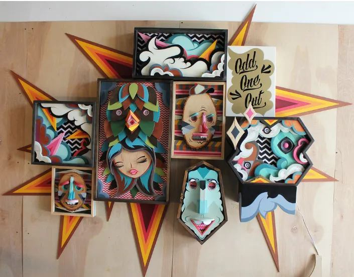 Instalación mural de Alex Yanes con rostros tridimensionales y fondo estrellado, título “Odd One Out”